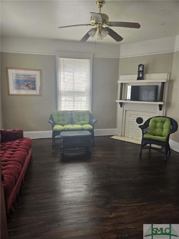 living room with ceiling fan and dark hardwood / wood-style floors