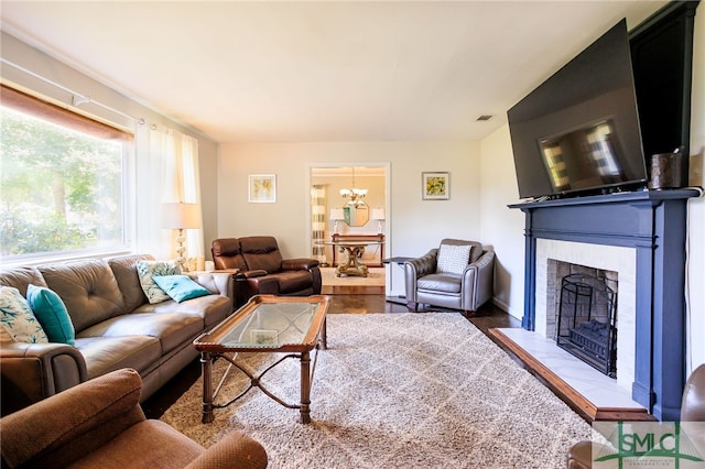 living room with a fireplace and hardwood / wood-style flooring