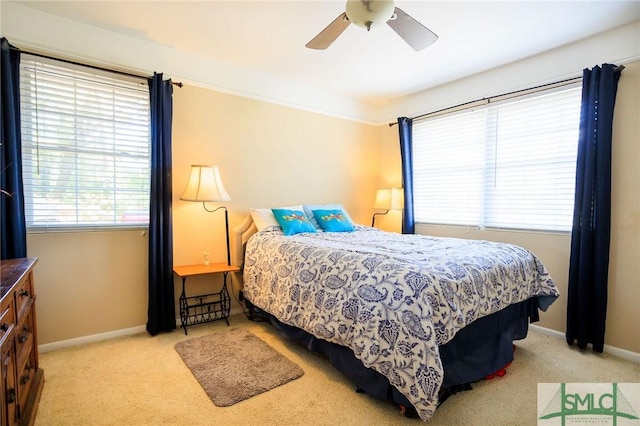 bedroom featuring carpet flooring, baseboards, and ceiling fan