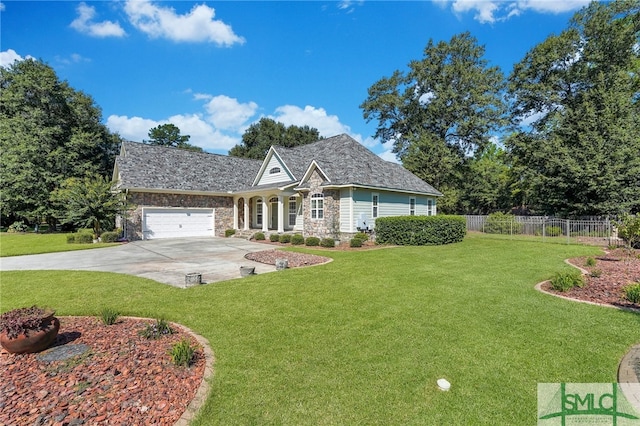 view of front of property with a garage and a front lawn