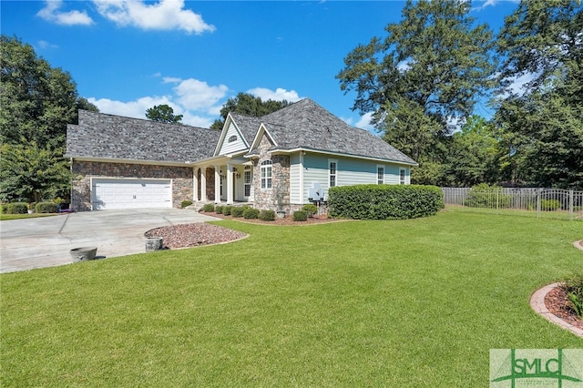 view of front facade with a garage and a front lawn