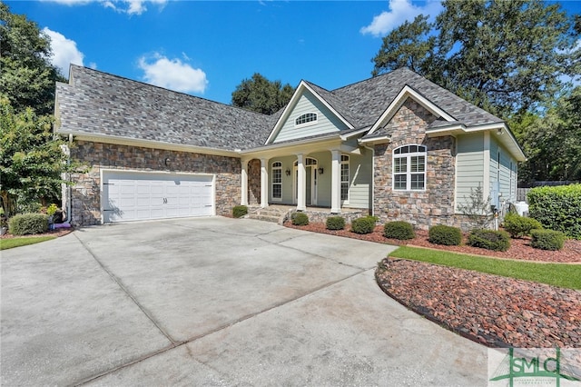 view of front facade with a garage and a porch