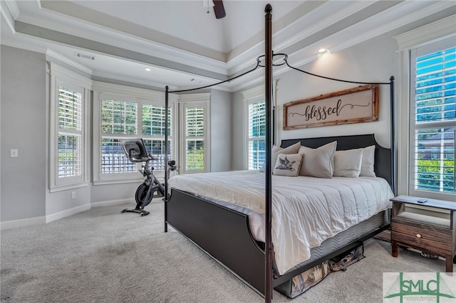 carpeted bedroom featuring ceiling fan and ornamental molding