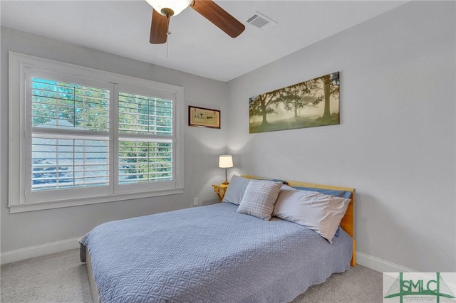 bedroom with baseboards, visible vents, ceiling fan, and carpet flooring