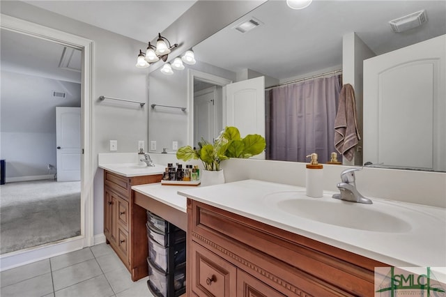 bathroom with vanity, walk in shower, and tile patterned floors