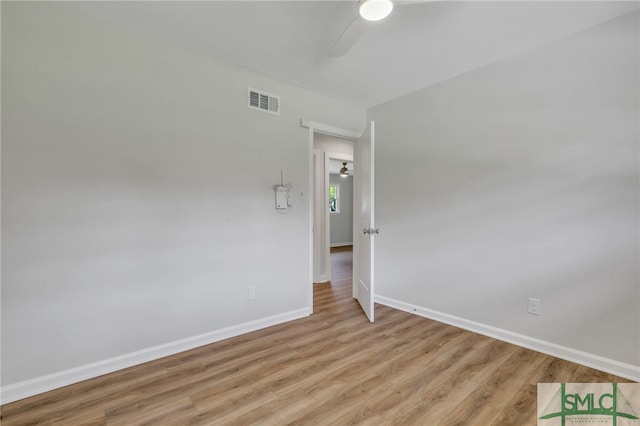 spare room featuring ceiling fan and light hardwood / wood-style floors