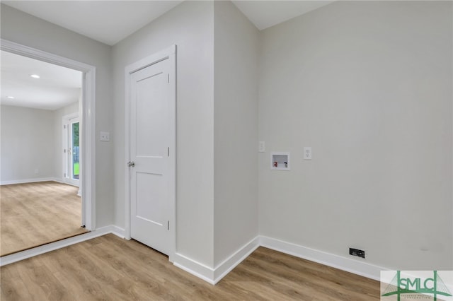 laundry room with light wood-type flooring and hookup for a washing machine