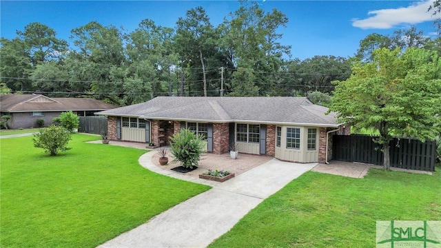 ranch-style home with a front yard