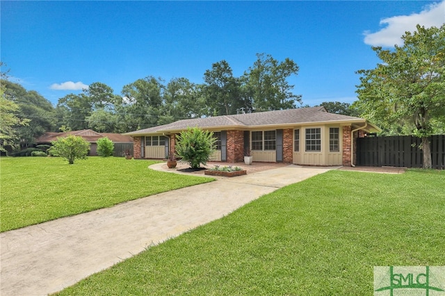 ranch-style home with a front lawn