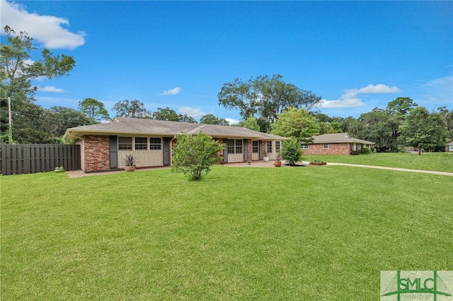 ranch-style house with a front yard