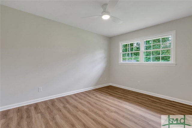 spare room featuring hardwood / wood-style floors and ceiling fan