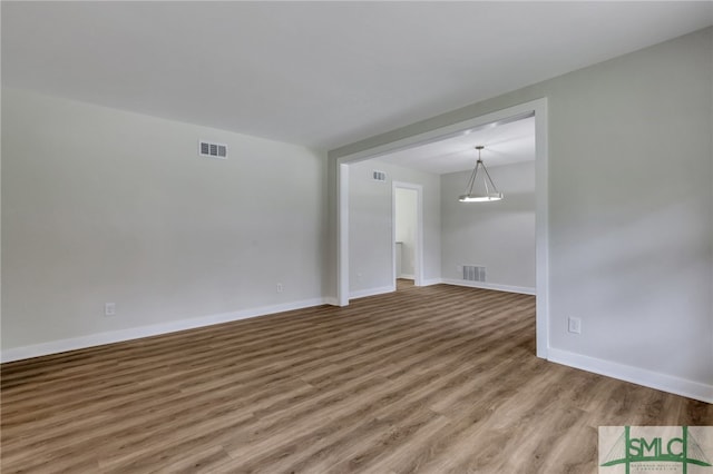 spare room featuring light hardwood / wood-style floors