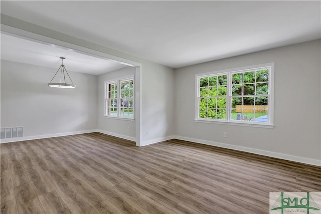 unfurnished room featuring hardwood / wood-style floors