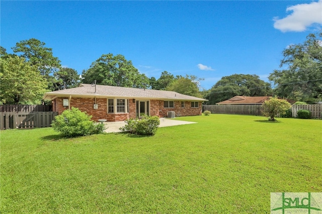 back of house featuring a yard, a patio area, and central air condition unit