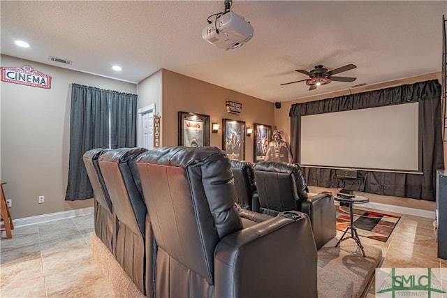 cinema featuring baseboards, visible vents, ceiling fan, a textured ceiling, and recessed lighting