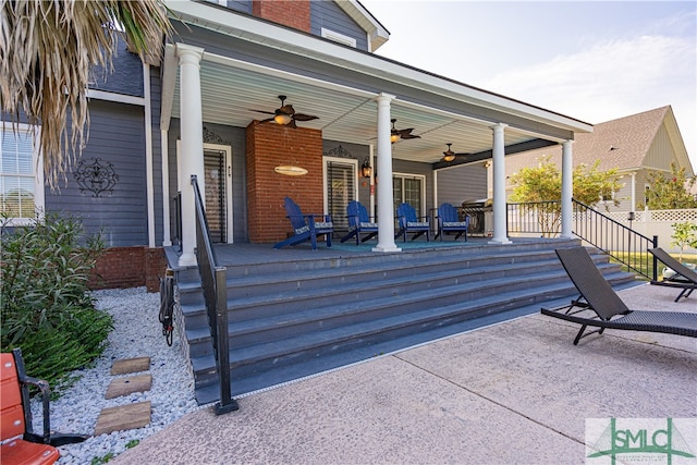 view of patio with ceiling fan and a porch