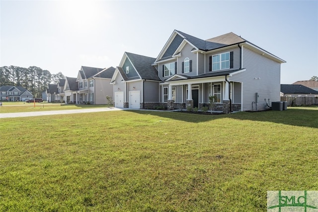 view of front of property with a garage, a front lawn, covered porch, and central AC