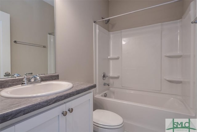 full bath featuring toilet, shower / bathtub combination, and vanity