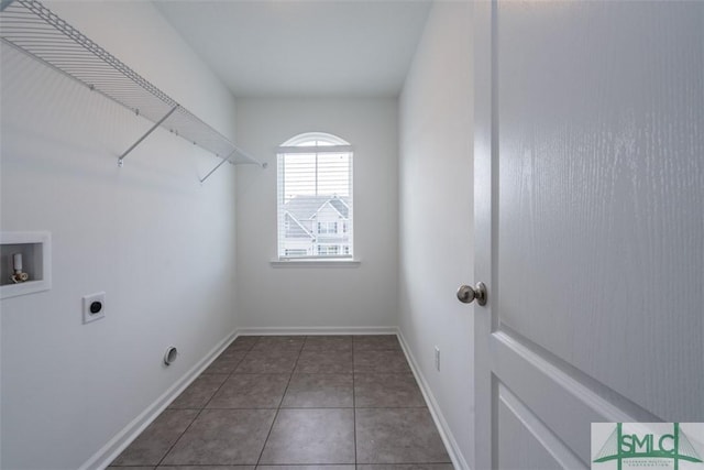 laundry area featuring laundry area, baseboards, tile patterned floors, hookup for a washing machine, and electric dryer hookup