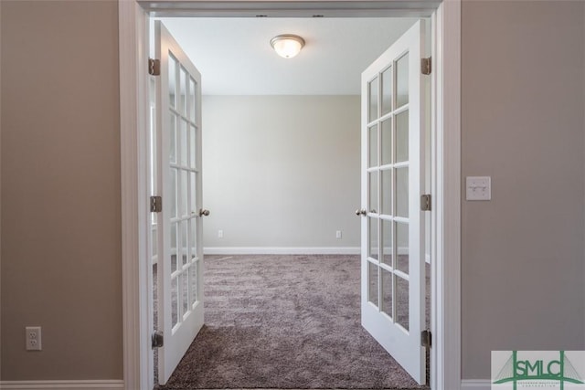 hall with carpet, french doors, and baseboards