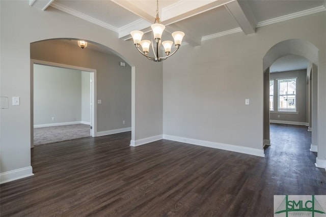 spare room with baseboards, beam ceiling, arched walkways, and dark wood-type flooring