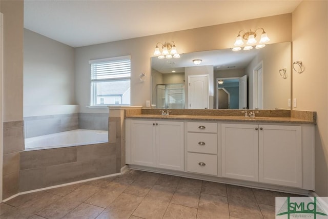 full bath with a sink, a shower stall, a bath, and double vanity