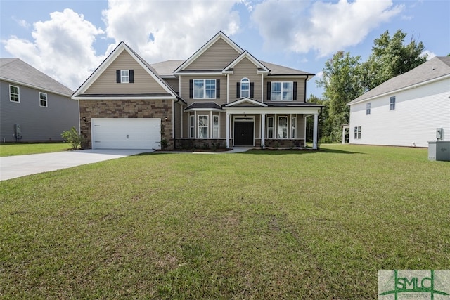 craftsman-style house featuring a porch, a garage, and a front yard