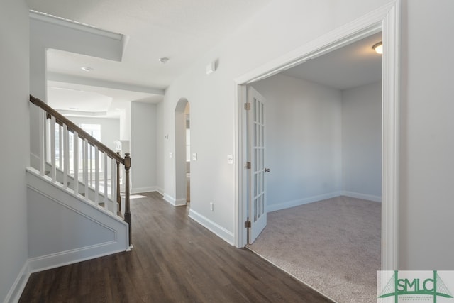 hall with dark hardwood / wood-style flooring