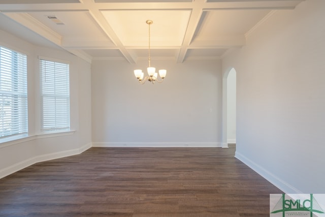 spare room featuring crown molding, dark hardwood / wood-style flooring, a chandelier, and coffered ceiling