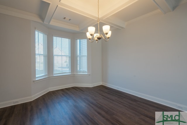 empty room featuring crown molding, dark wood-type flooring, and an inviting chandelier