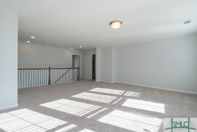 empty room featuring light colored carpet