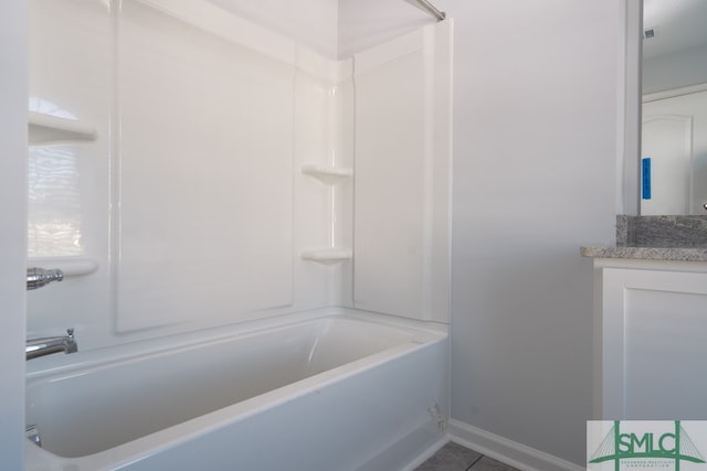 bathroom with tile patterned floors, vanity, and tub / shower combination