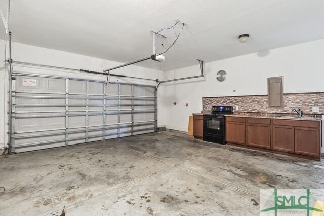 garage featuring a garage door opener and sink