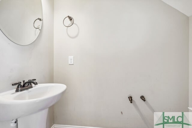 bathroom with lofted ceiling