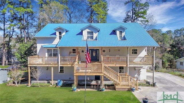 back of property with a yard and a porch