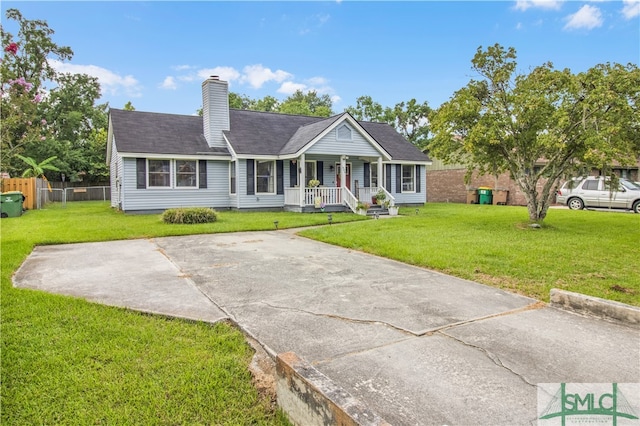 ranch-style home featuring a porch and a front lawn