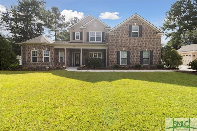 traditional home featuring brick siding and a front lawn