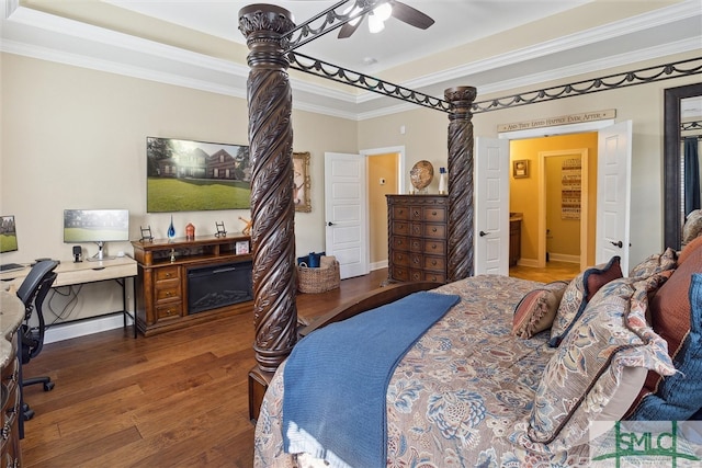 bedroom featuring baseboards, a fireplace, ornamental molding, and wood finished floors