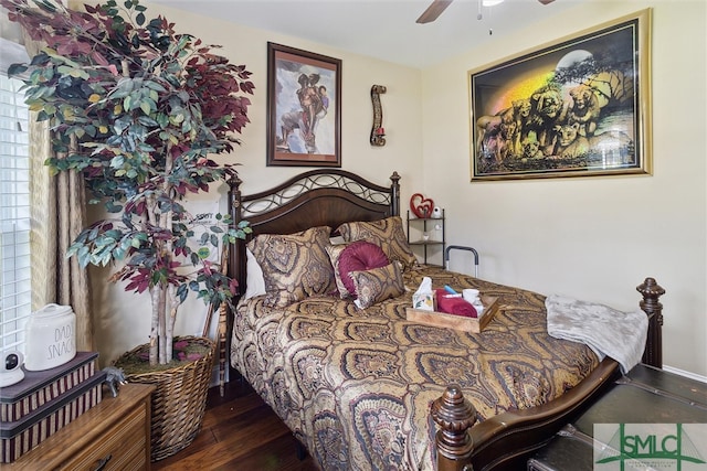 bedroom featuring ceiling fan and dark wood-style flooring