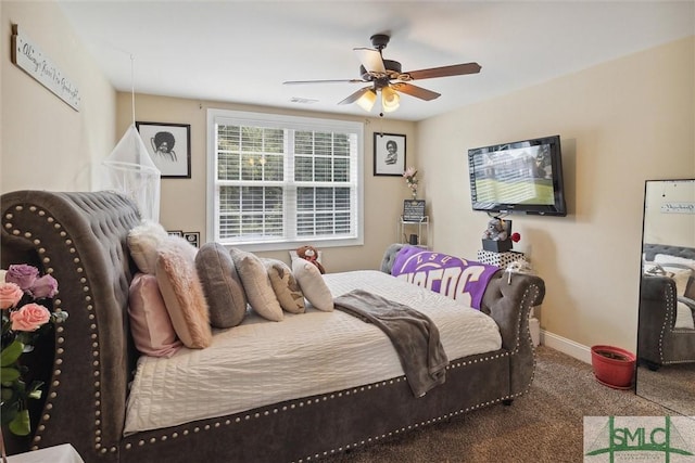 bedroom featuring a ceiling fan, carpet flooring, visible vents, and baseboards