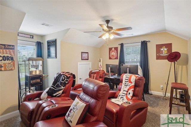 carpeted cinema featuring lofted ceiling, ceiling fan, visible vents, and baseboards