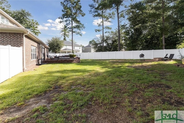 view of yard featuring a fenced backyard