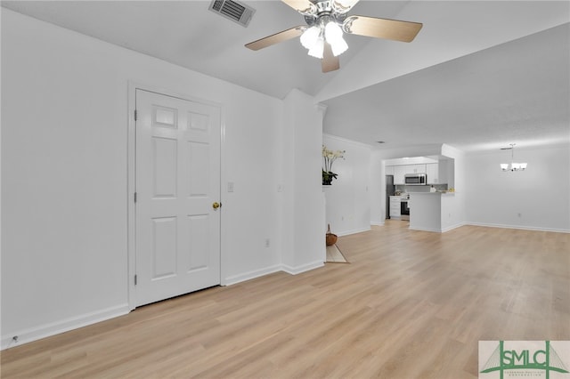 unfurnished living room featuring light wood-type flooring, ceiling fan, and lofted ceiling