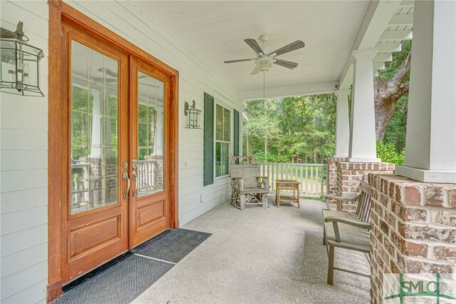 view of patio featuring ceiling fan, covered porch, and french doors