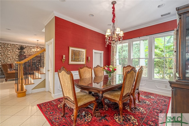 dining room featuring light tile patterned floors, an inviting chandelier, and ornamental molding