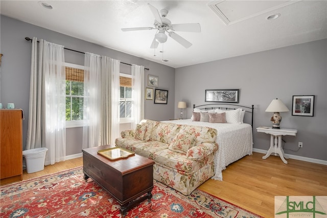 bedroom with ceiling fan and light wood-type flooring