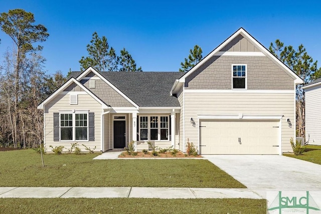 craftsman inspired home with a front yard and a garage