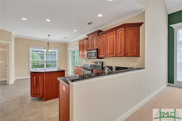 kitchen with a center island, hanging light fixtures, kitchen peninsula, dark stone counters, and appliances with stainless steel finishes