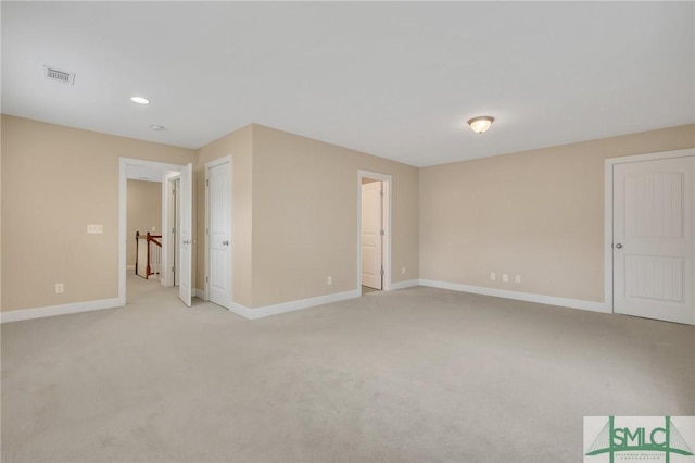 empty room featuring light colored carpet