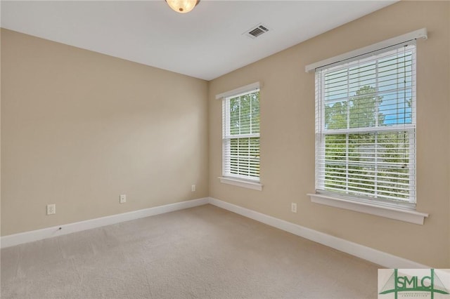 empty room featuring carpet flooring